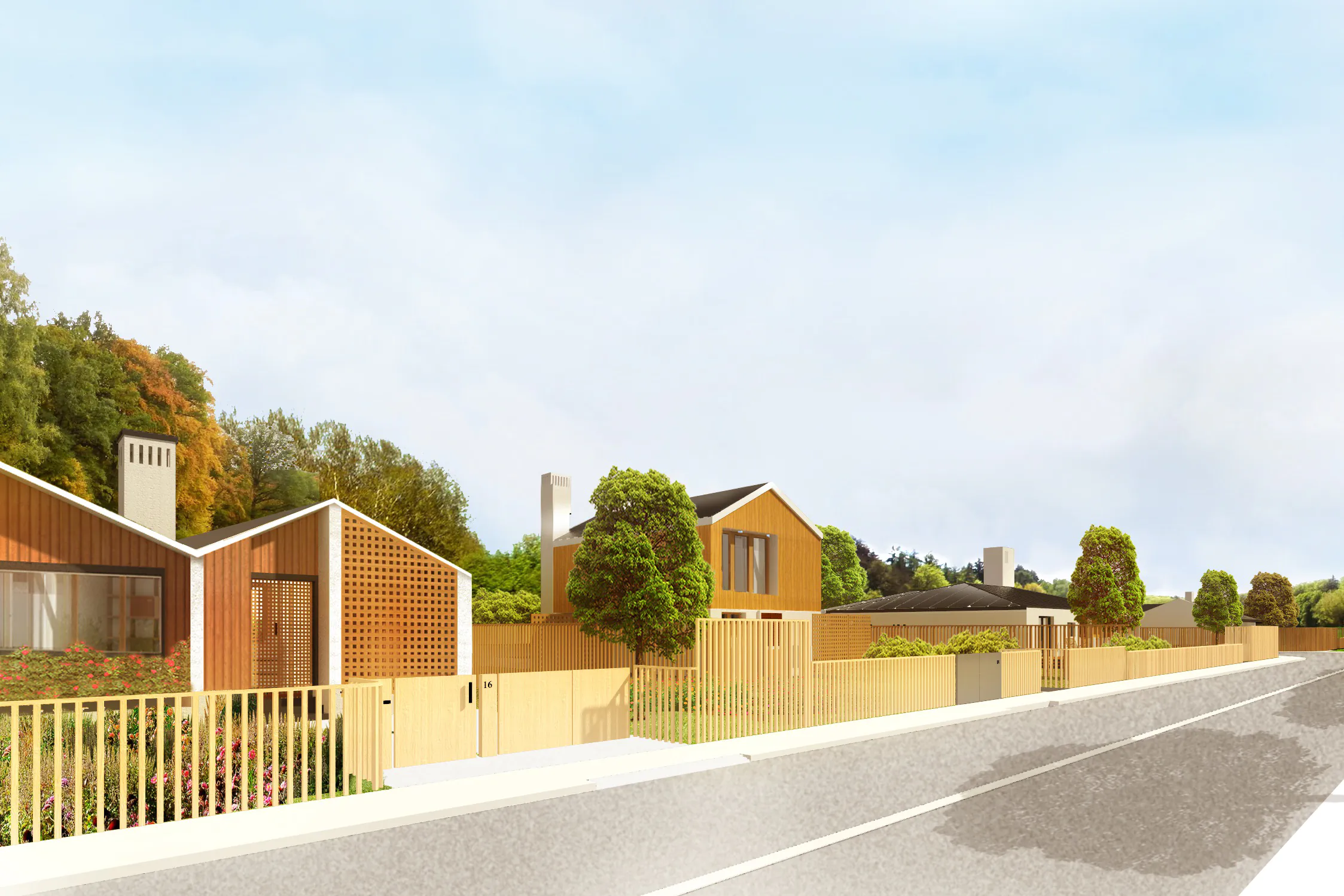 Дорога с забором и зданиями вдоль неё под облачным небом.