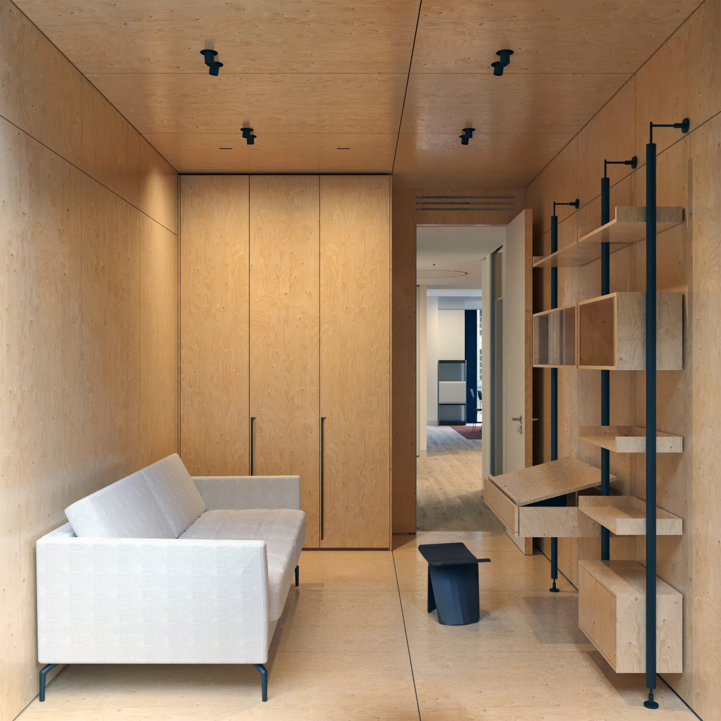 A modern room with a white sofa, wooden walls, and a shelving unit.